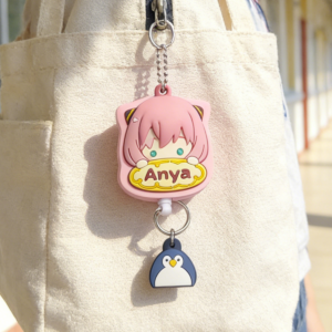 Anya Forger Retractable Keychain, Spy x Family Anime Soft Rubber Key Ring with Penguin Charm, Cute Anti-Lost Accessory for Students & Anime Fans